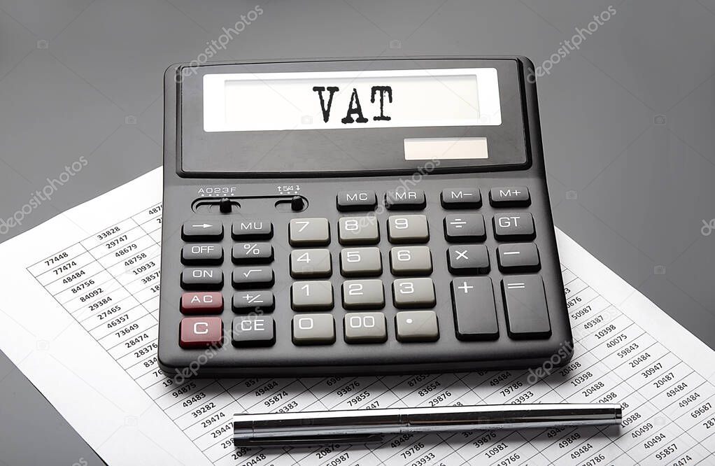 VAT word on the calculator on chart with pen