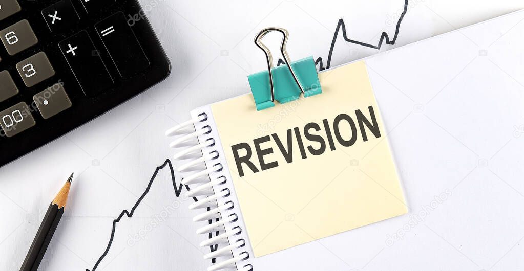 Stickers with pencils and notebook with text REVISION on the wooden background