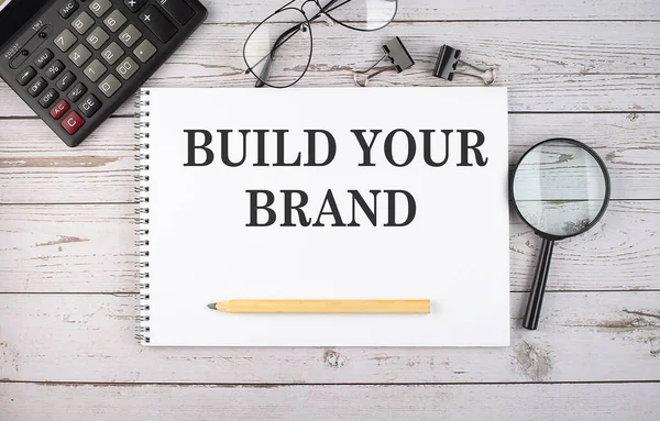 Порожній Блокнот Текстом Build Your Brand Білому Тлі Калькулятором Офісними — стокове фото