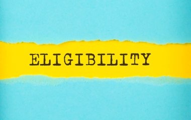 Yırtık kağıt üzerinde ELİJİBİLİK metin, sarı arkaplan