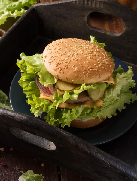 Homemade hamburger on rustic table — Stock Photo, Image