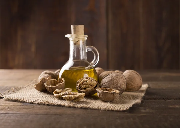 Walnuts with walnut oil — Stock Photo, Image