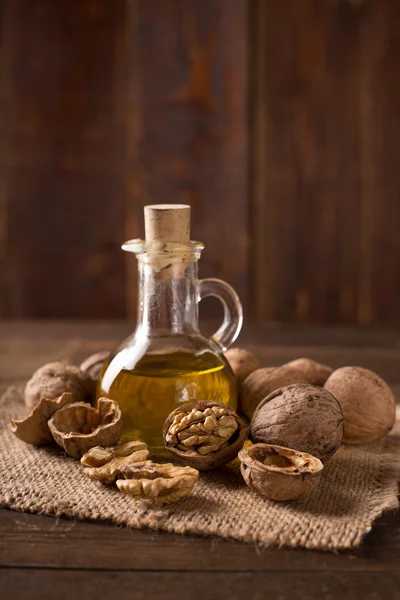 Walnuts with walnut oil — Stock Photo, Image