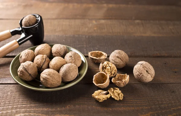 Walnuts on wooden table — Stock Photo, Image