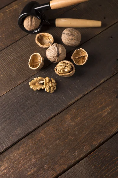 Walnuts on wooden table — Stock Photo, Image