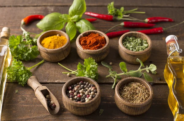 Powder spices on wooden table — Stock Photo, Image
