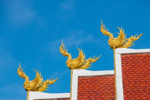 Three golden Himmapan Hongsa statue over the buddhist church roo — Stock Photo, Image