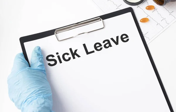 Sick Leave write on a paperwork isolated on Office Desk