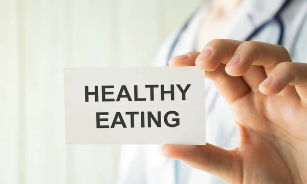 Doctor Hands Holding White Card Sign Healthy Eating Text Message — Stock Photo, Image