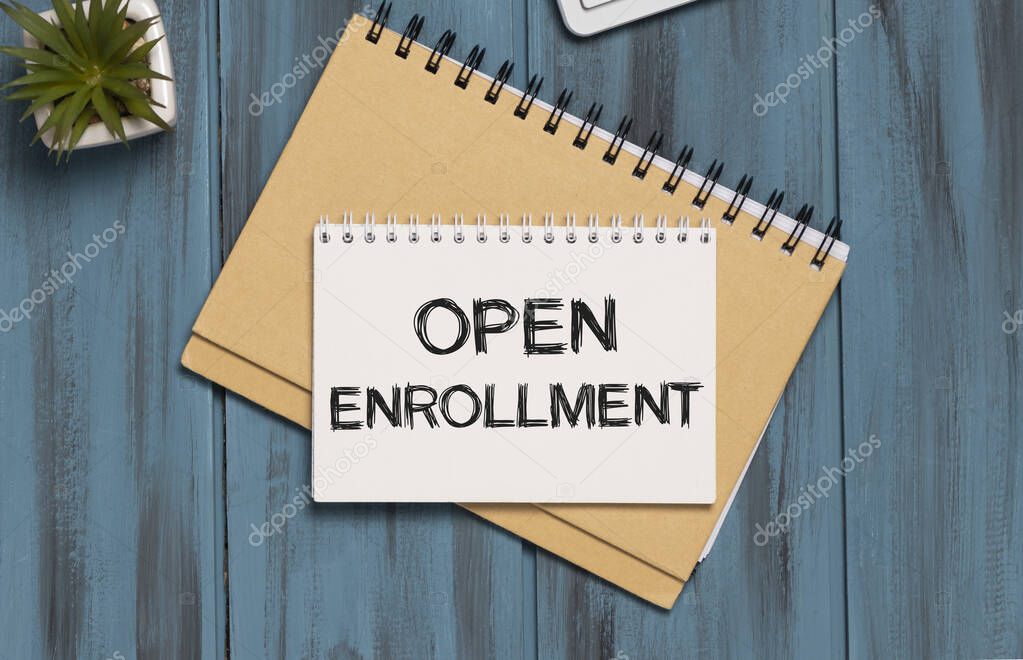 Doctor's desk with notebook and text - Open Enrollment