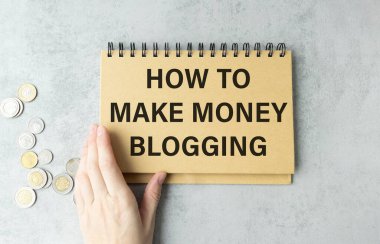 Business concept - Top view notebook writing How to make money blogging