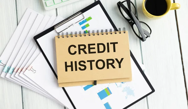 Credit History 摘要日历闭合背景 在带有空间的记事本上写下的业务概念 — 图库照片