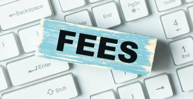 Klavye ücretli tahta blok, iş konsepti.