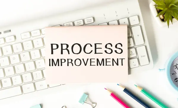 Notepad Process Improvement Text Keyboard Pencils Paper Clips Potted Flower — Stockfoto