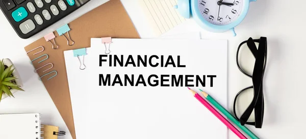 Financial Management text on paper on office desk, business conceptual