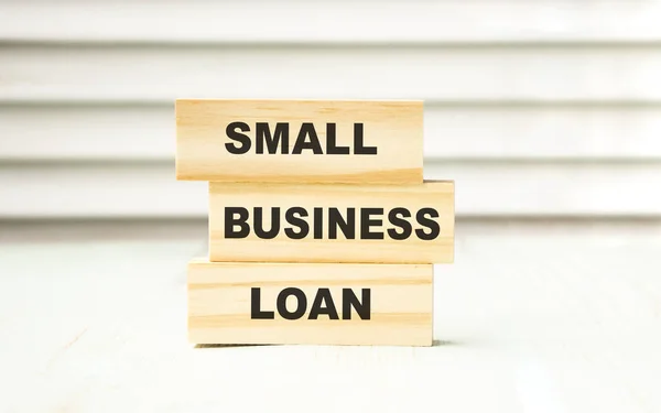 small business loan - word on wooden block