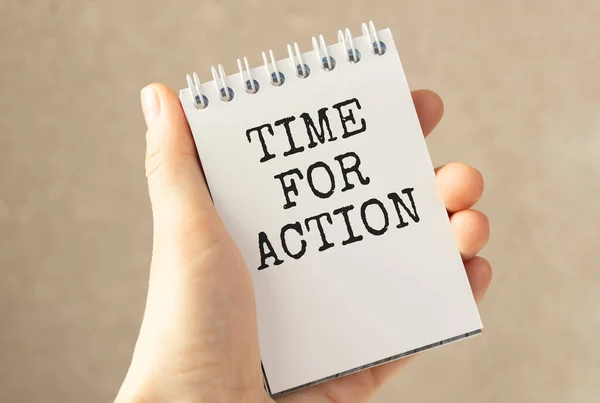 business woman holding notebook with the text Time for action