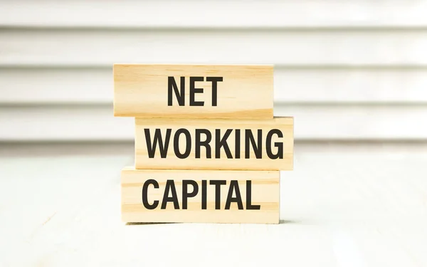 Net Working Capital text on wooden blocks.