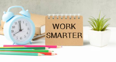 Work Smarter. text on white notepad paper on white background.