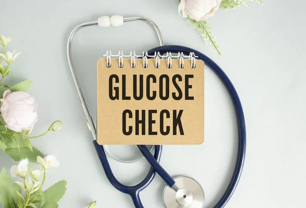 card with glucose check text message isolated on hospital clinic office background.