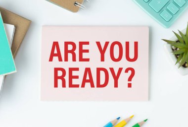 Are You Ready, text on notepad on office desk.