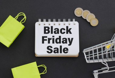 Kara Cuma satışı tabelası siyah arkaplanda.