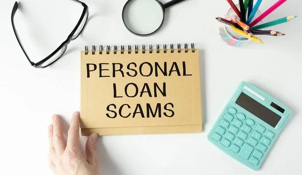 Financial concept meaning Personal Loan Scams with phrase on the piece of paper.