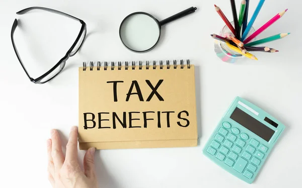 White Tablet Inscription Tax Benefits Background Accounting — Stock Photo, Image