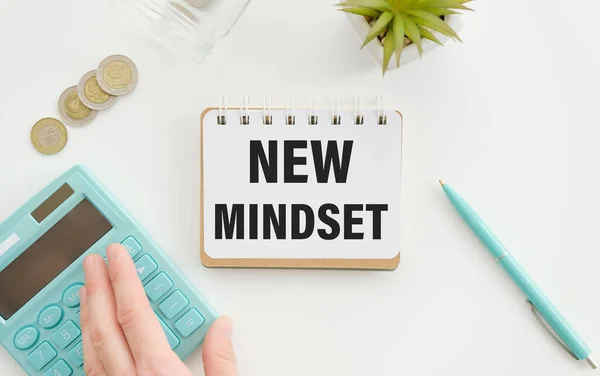 New Mindset - New Results text on sticky notes isolated on office desk