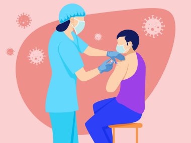 Kadın doktor Corona 'ya aşıyı veriyor.