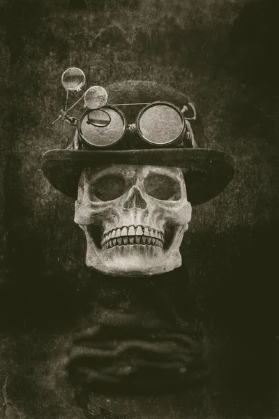 Steampunk halloween skull with bowler hat and goggles grunge eff