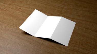 Ahşap arka planda beyaz broşür.