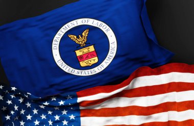 Birleşmiş Milletler Çalışma Bakanlığı bayraklarıyla birlikte Amerika Birleşik Devletleri bayrağı da aralarındaki bağlantıyı simgeliyor.