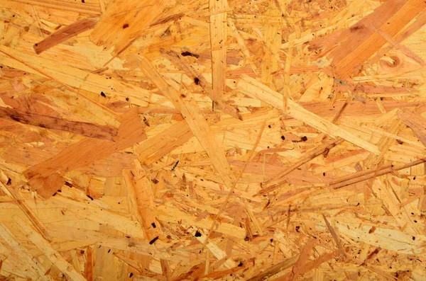 Glued wood chip texture. Wooden board texture, OSB wooden background