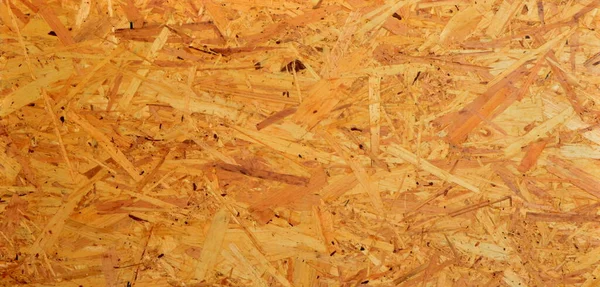 Glued wood chip texture. Wooden board texture, OSB wooden background