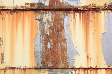 Paslı yüzey arka planı. Aşınmış metal zemin. Paslı mavi boyanmış metal duvar. pas ve eski mavi ve sarı boya metal bir yüzeyde. 