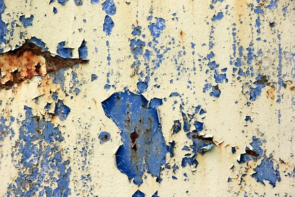 Rusty surface background. Corroded metal background. Rusted blue painted metal wall. rust and old blue and yellow paint on a metal surface.