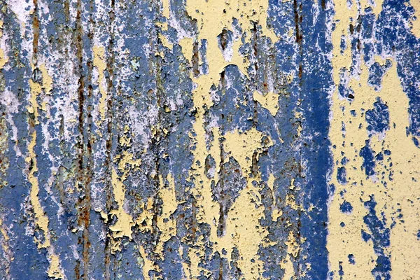 Rusty surface background. Corroded metal background. Rusted blue painted metal wall. rust and old blue and yellow paint on a metal surface.