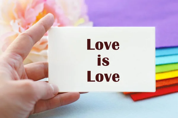 Woman Hand Holds Piece Paper Inscription Love Love Background Stack — Stock Photo, Image