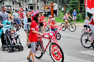 Waskesiu, Saskatchewan, Canada - July 1, 2019: Colorful parade floats and people take part in a parade to celebrate Canada Day in Prince Albert National Park.