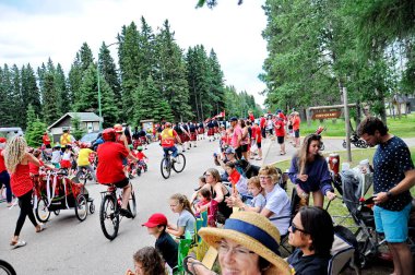 Waskesiu, Saskatchewan, Canada - July 1, 2019: Colorful parade floats and people take part in a parade to celebrate Canada Day in Prince Albert National Park.