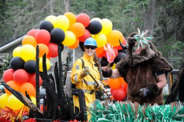 Waskesiu, Saskatchewan, Canada - July 1, 2019: Colorful parade floats and people take part in a parade to celebrate Canada Day in Prince Albert National Park.