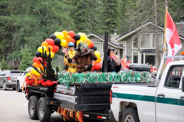 Waskesiu, Saskatchewan, Canada - July 1, 2019: Colorful parade floats and people take part in a parade to celebrate Canada Day in Prince Albert National Park.