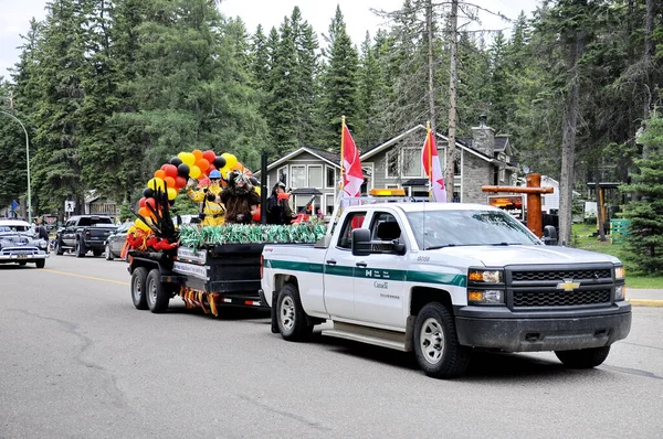 Waskesiu, Saskatchewan, Canada - July 1, 2019: Colorful parade floats and people take part in a parade to celebrate Canada Day in Prince Albert National Park.