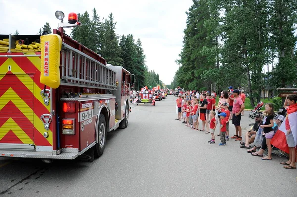 Waskesiu, Saskatchewan, Canada - July 1, 2019: Colorful parade floats and people take part in a parade to celebrate Canada Day in Prince Albert National Park.