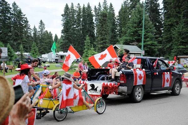 Waskesiu, Saskatchewan, Canada - July 1, 2019: Colorful parade floats and people take part in a parade to celebrate Canada Day in Prince Albert National Park.