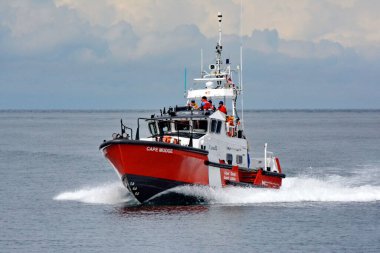 Sandspit, Haida Gwaii, Canada, July 19, 2023: Canadian Coast Guard ship, Cape Mudge on patrol off Sandspit. In the background ocean and the hills of Haida Gwaii.