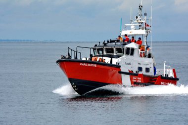 Sandspit, Haida Gwaii, Canada, July 19, 2023: Canadian Coast Guard ship, Cape Mudge on patrol off Sandspit. In the background ocean and the hills of Haida Gwaii.