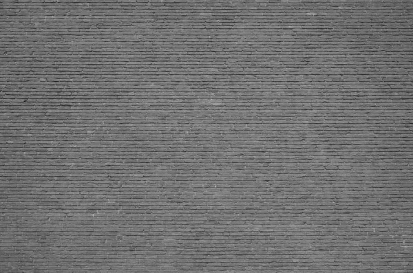 Muro di mattoni grigi — Foto Stock