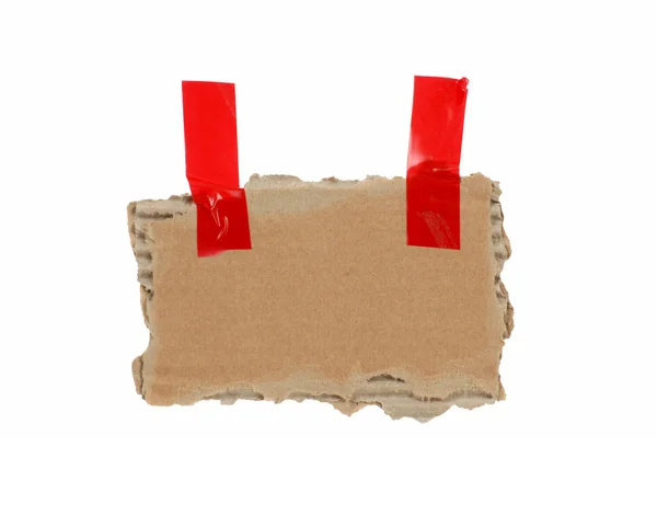 Old isolated cardbard with red tape — Stock Photo, Image